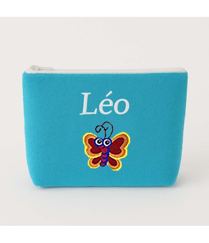 Broderie papillon sur Trousse de toilette...